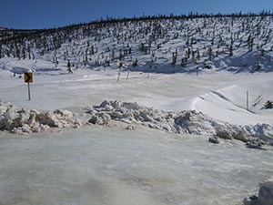 click for larger view of photo: Ice jam
at MP 93. snow drift at American Summit 