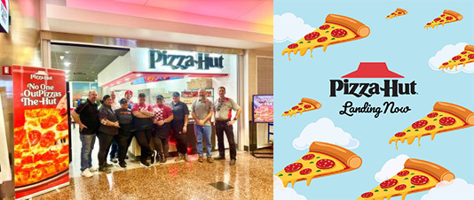 Pizza Hut crew in front of their new location at ANC