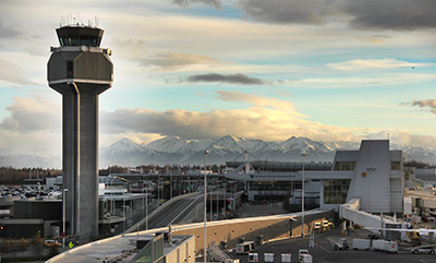 Domestic Terminal Anchorage Tower and the Kenai Mountains to the south. Photo by Rob Stapleton