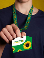 man holding a sunflower program lanyard