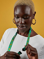 woman holding a sunflower program lanyard
