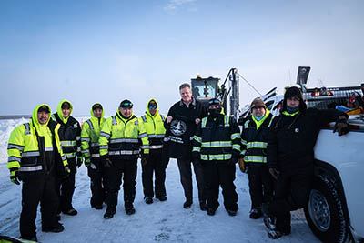 photo: Governor Mike Dunleavy with the Kuskokwim Ice Road Maintenance Crew