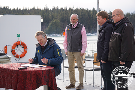 Click for larger view: Governor Mike Dunleavy, Bruce Swagler, Tidewater  VP Operations, 
DOT&PF Commissioner Ryan Anderson aboard the MV Tazlina during MOU signing ceremony.