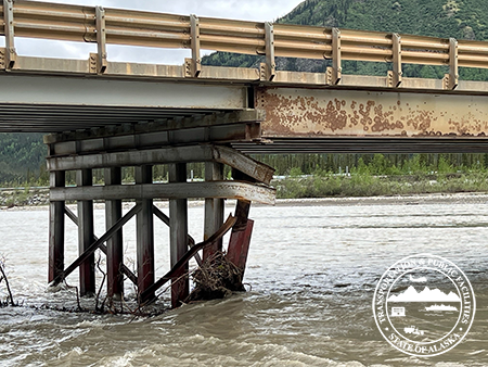 Click to view: Damage to girders and a pier underneath the Koyukuk River bridge across the Dalton Highway at milepost 188 between Coldfoot and Wiseman. Repair work on the bridge will require closing the bridge daily from 9 p.m. to 9 a.m. for two weeks beginning June 21. (Photo: Alaska DOT&PF)