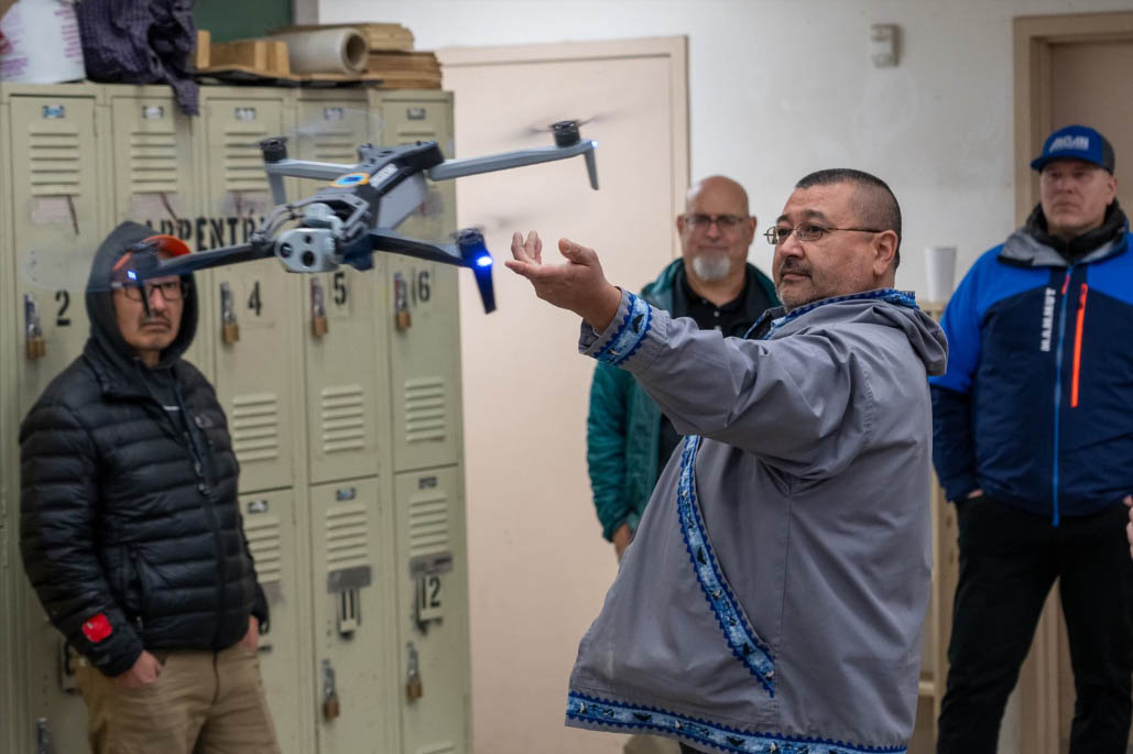 Photo: Clarance Daniel, Community Development Director of the Association of Village Council Presidents and Alaska representative on the Tribal Transportation Program Coordinating Committee, releases drone during training in Bethel.