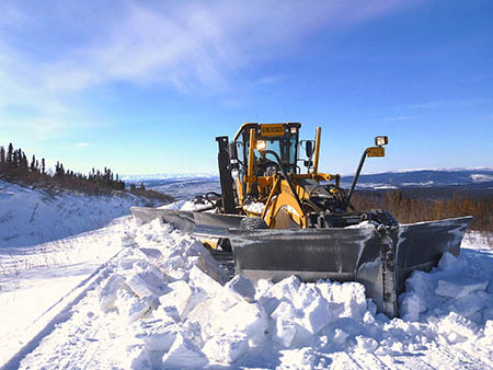 Photo: Equipment opening the Taylor Highway, courtesy of DOT&PF staff