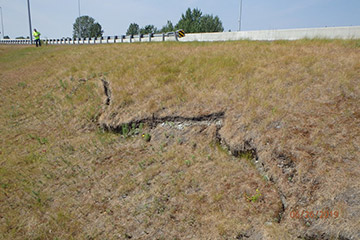 Embankment cracks along Dowling Road at location adjacent to Tina Lake.