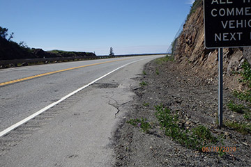 Pavement damage due to rock fall along the Seward Highway.