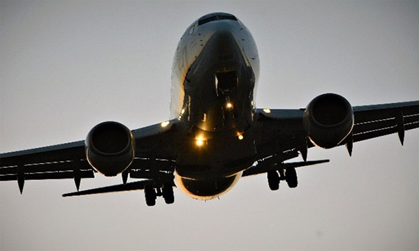 view from below of a jet aircraft in flight
