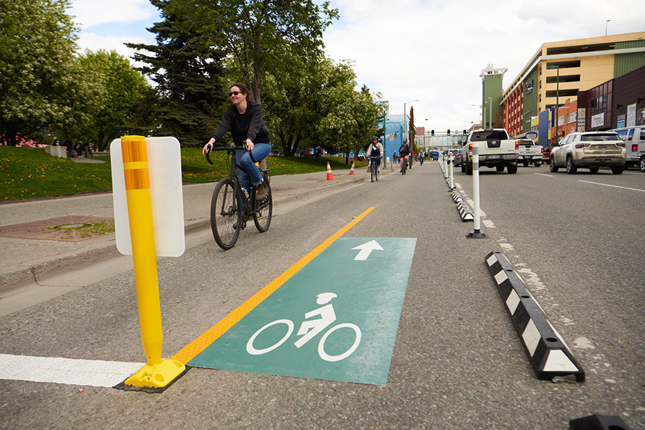 Bicycle riders in a protected bike lane in Anchorage