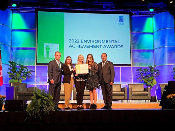 FAI Environmental Manager, Elise Thomas, FAI Airport Director, Angie Spear, and Alaska DOT&PF PFAS Program Manager, Sammy Cummings, pose with ACI-NA representatives at ACI-NA's annual conference in Minneapolis, MN.