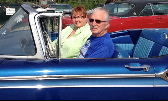 Burnie Hall in a convertible