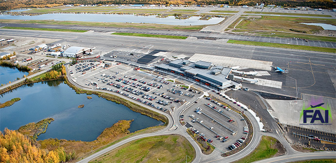 photo of FAI from overhead including parking, terminal, hangars, apron, floatplane pond, and runways