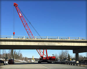Click for larger photo of crane with Glenn Highway Overpass