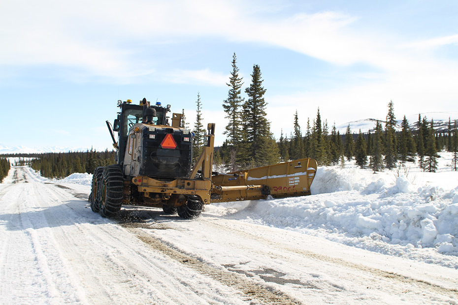 Heavy equipment moving snow off of Denali Highway