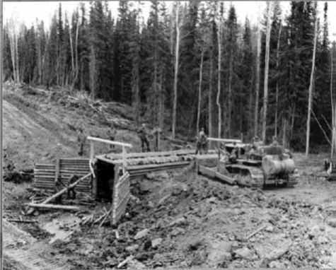 Log box culverts were used everywhere along the highway to speed up construction because timber was the only material that was readily available