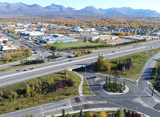Highway overpass with a roundabout underneath in Anchorage