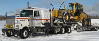 photo of truck hauling equipment