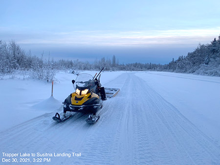 snowmachine trail grooming on Susitna Landing Trail