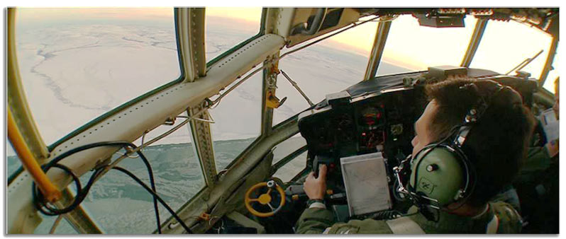 Pilot overlooking Arctic ice