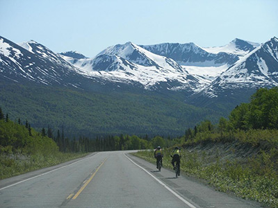A bicyclist rides on the highway, 2009. Photo credit: Bob Laurie, Alaska DOT&PF
