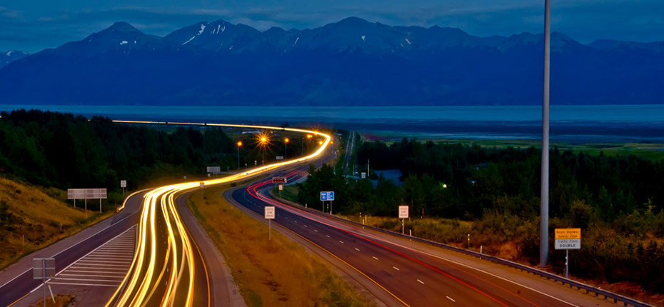 Summer evening traffic heads to Anchorage on the New Seward Highway