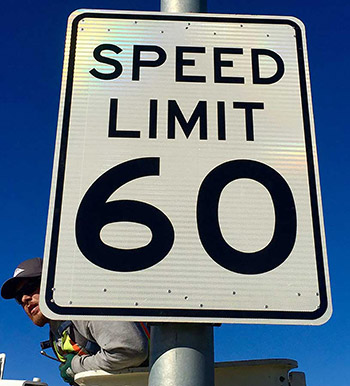 sign displaying road speed limit 60 miles per hour