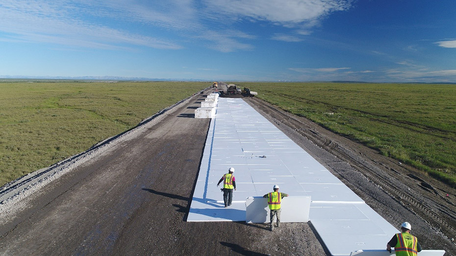 Construction crews install foam board insulation on the Dalton Highway north of the Brooks Range.