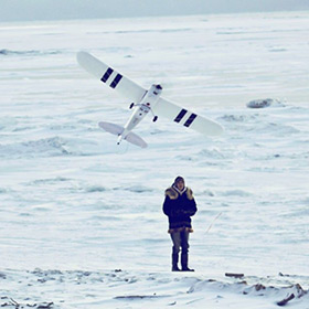 image showing a recreational drone pilot in the snow